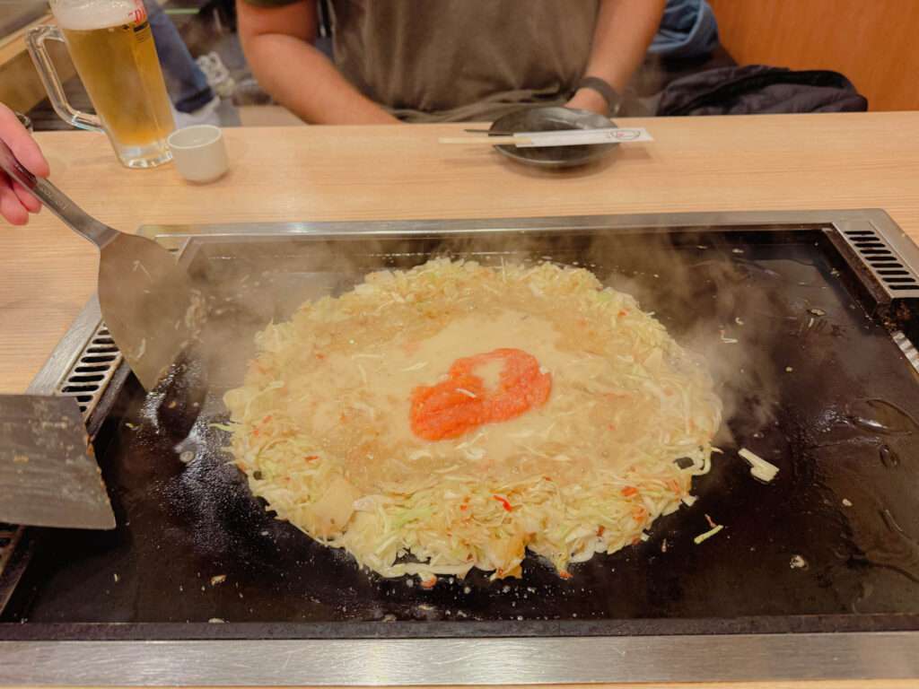 The monjayaki dish from Tokyo cooking on a sizzling griddle