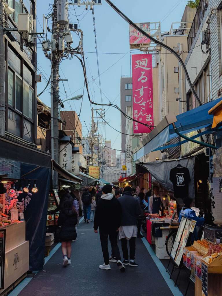 A busy pedestrian street in the Tsukiji Fish Market​ of Tokyo