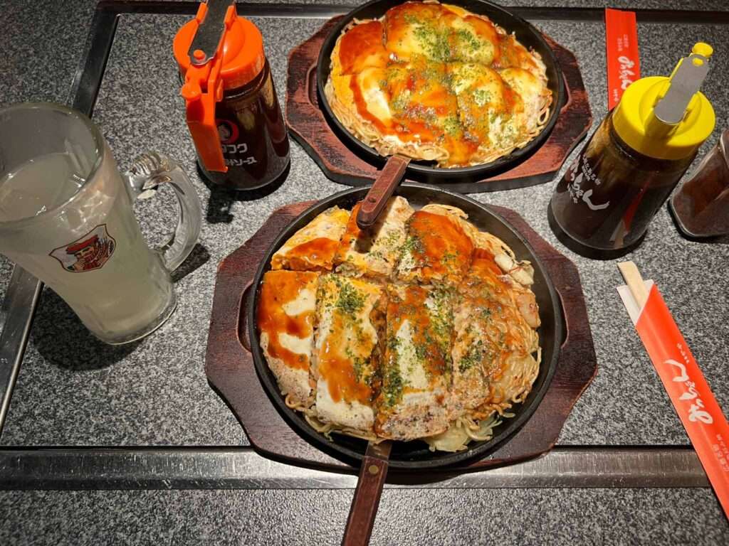 The okonomiyaki, a savory Japanese pancake that was created in Hiroshima, Japan