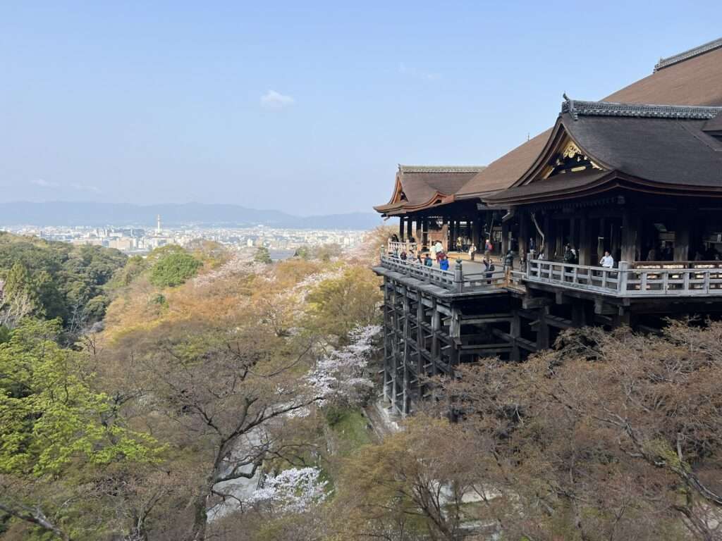 A large wooden temple overlooking the city of Kyoto Japan