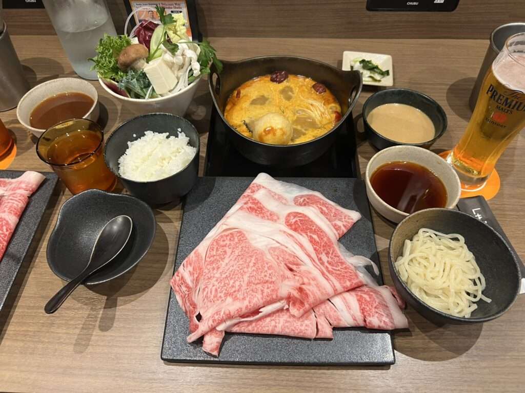 The delicious shabu shabu dish of meat, self-cooked in a hot pot of broth, popular in Osaka, Japan