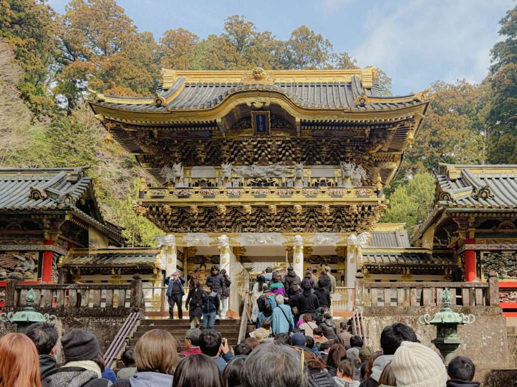 The crowd standing at the entrance of the Nikko Toshogu Shrine​ as a day trip to Nikko