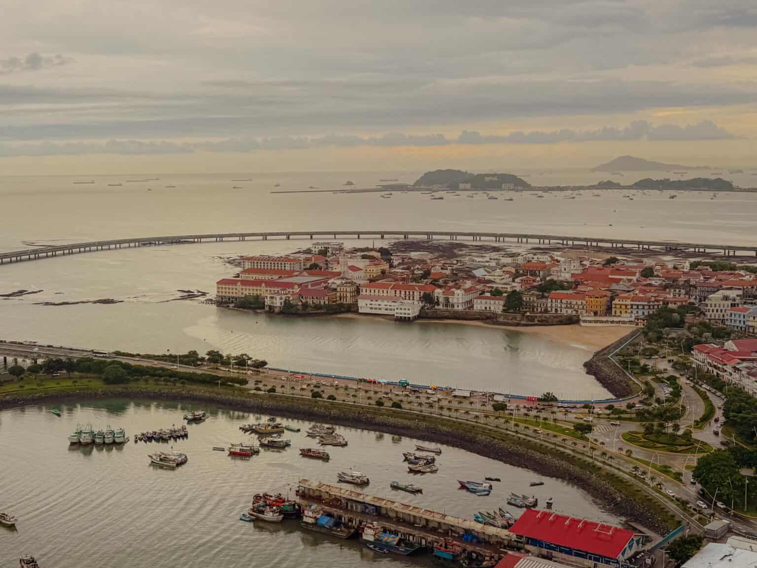 Aerial view of Casco Viejo peninsula, Panama City, with ships queued on the Pacific horizon waiting to enter the Panama Canal