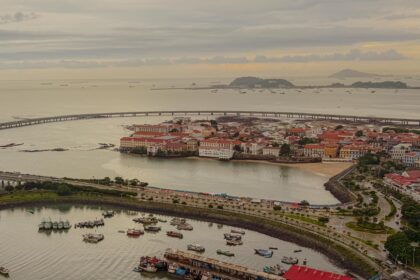 Aerial view of Casco Viejo peninsula, Panama City, with ships queued on the Pacific horizon waiting to enter the Panama Canal