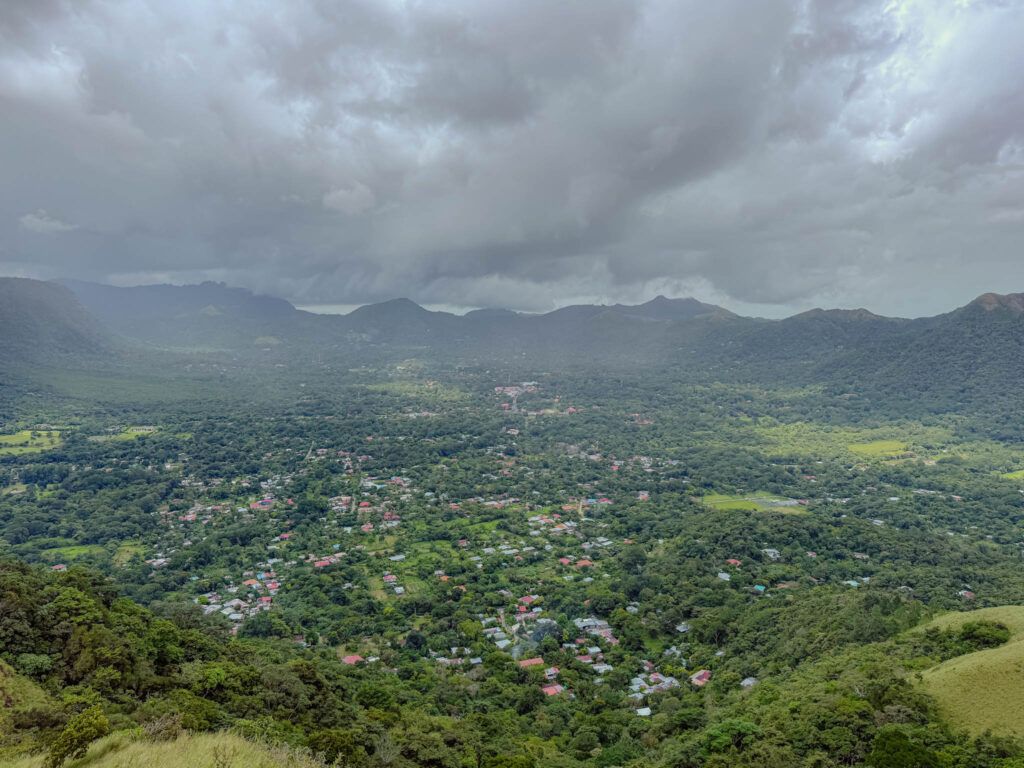 View over the Valle de Anton crater valley from above, town and jungle visible below surrounded by the crater rim, Panama -- day trips from Panama City