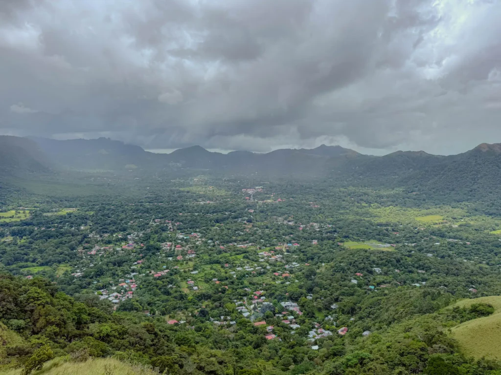 View over the Valle de Anton crater valley from above, town and jungle visible below surrounded by the crater rim, Panama -- day trips from Panama City