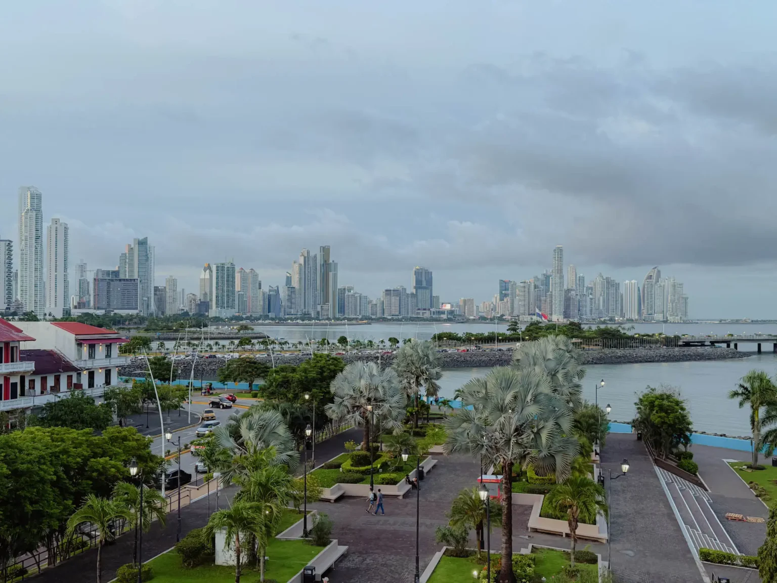 Panama City skyline at dusk with the old town and modern skyscrapers visible across the bay - where to stay in Panama City