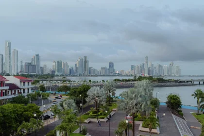 Panama City skyline at dusk with the old town and modern skyscrapers visible across the bay - where to stay in Panama City