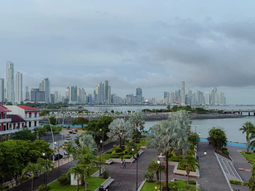Panama City skyline at dusk with the old town and modern skyscrapers visible across the bay - where to stay in Panama City
