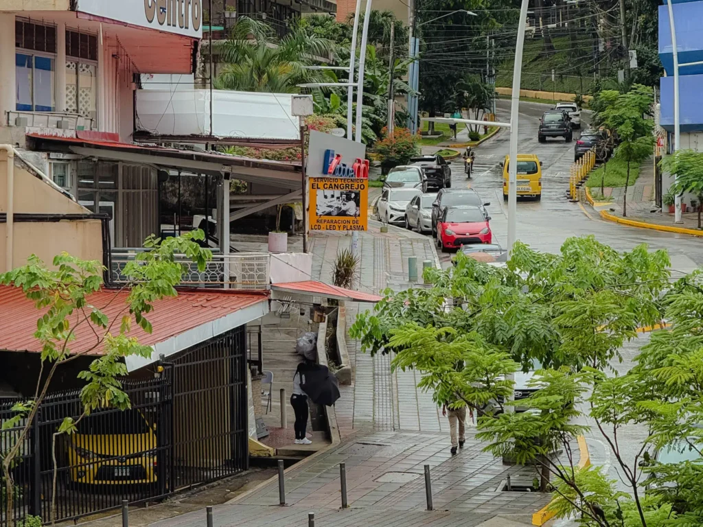Wide tree-lined street in El Cangrejo neighborhood Panama City with cafes and local shops - El Cangrejo Panama City neighborhood