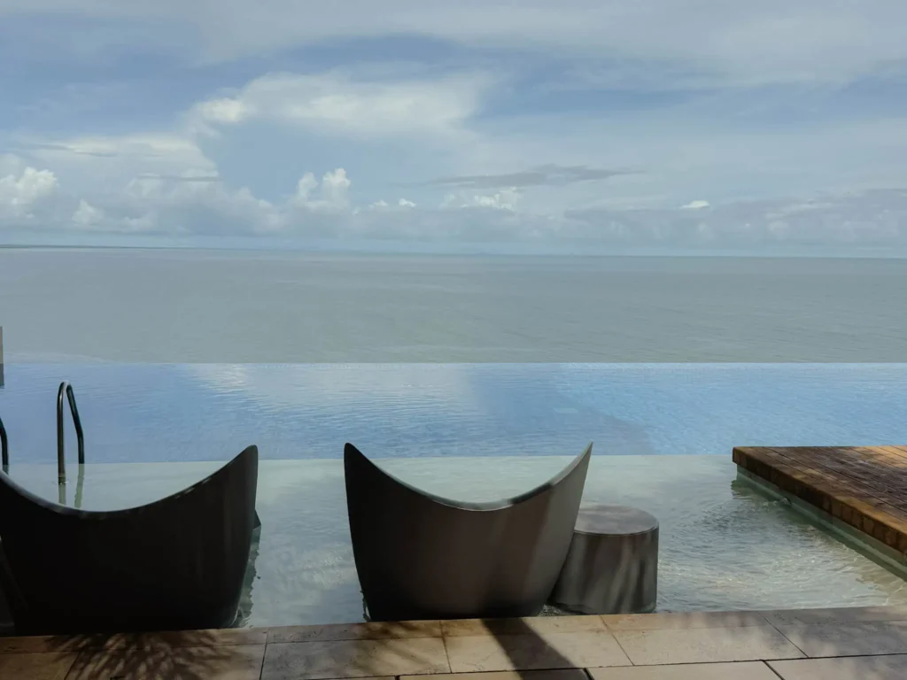 Outdoor pool overlooking Panama City bay at a Punta Pacifica hotel with city skyline in background - Punta Pacifica hotels with views Panama City