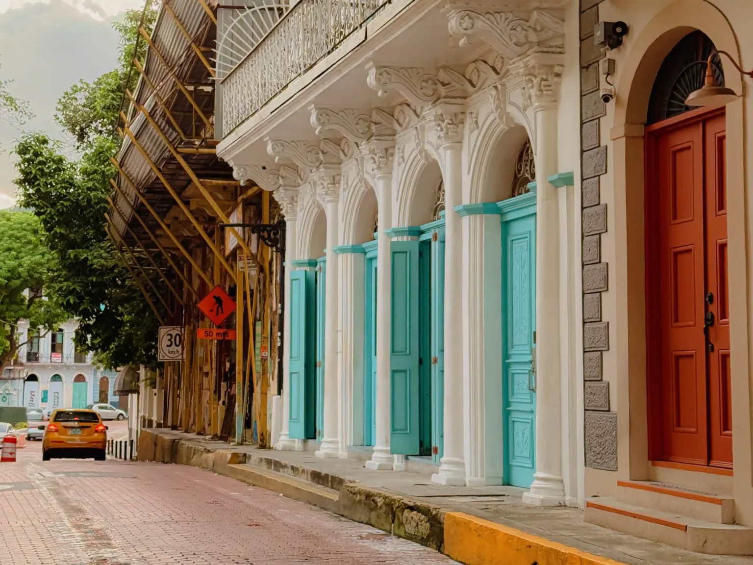 Ornate white colonial facade with teal arched doors in Casco Viejo, Panama City — things to do in Panama City