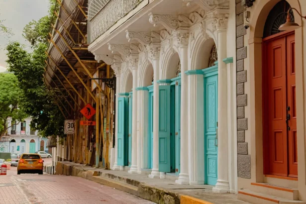 Ornate white colonial facade with teal arched doors in Casco Viejo, Panama City — things to do in Panama City