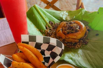 Traditional Panamanian dish served on a banana leaf with plantain fries and a fruit drink at Donde Giselle in Boquete Panama -- Boquete Panama