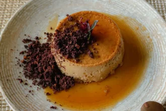Coffee flan with caramel sauce and chocolate crumble on a ceramic plate at Finca Lerida restaurant in Boquete Panama -- Boquete Panama