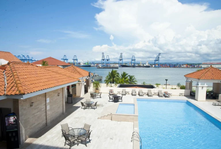 Rooftop pool terrace at the Radisson Colon 2000 with container port cranes and Colon Bay behind -- Portobelo Panama