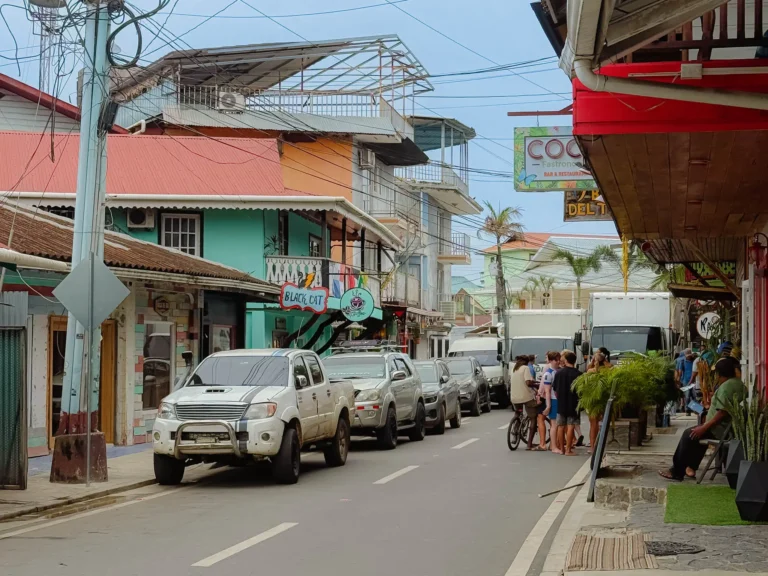 Colorful main street with shops and travelers in Bocas Town, Bocas del Toro