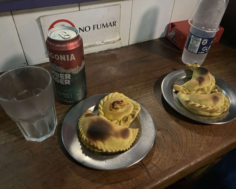 Argentina – Food and Drinks – empanadas A plate of empanadas and a beer - Argentina food and drinks