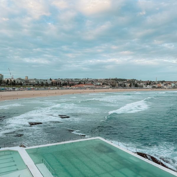 Australia – Sydney-076 Large pools in the cliffside overlooking an ocean harbor with a beach behind it - top things to do in Sydney