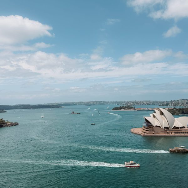 Australia – Sydney-092 Boats going past the Sydney Opera House in the harbor - top things to do in Sydney
