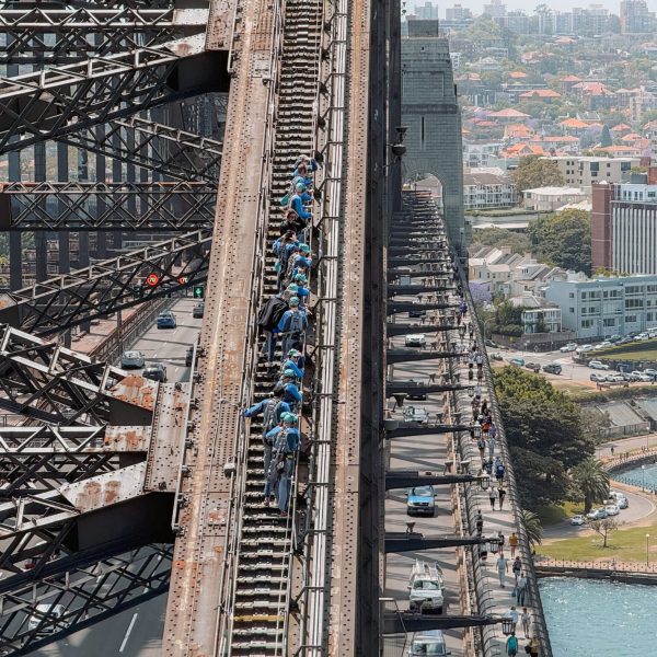 Australia – Sydney-096 People climbing up and over a bridge over water - top things to do in Sydney