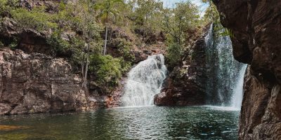 A waterfall flowing into a large pond - day trips from Darwin