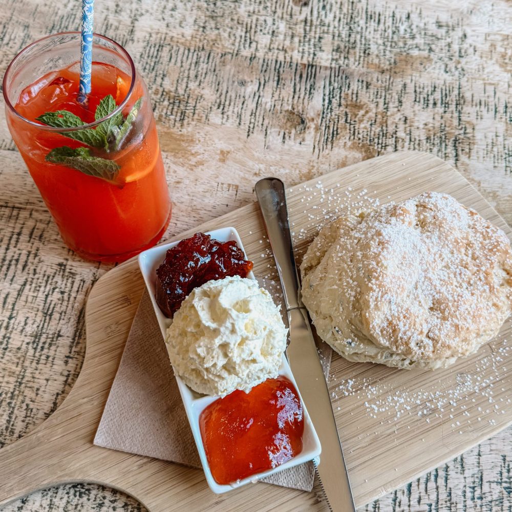 Emu Bay Lavender Farm – Kangaroo Island – Australia – 1 A scone, jar with jam and whipped cream, and red juice as seen from above - Kangaroo Island itinerary