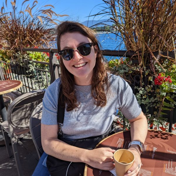 Girl in sunglasses drinking a coffee in Geneva Switzerland