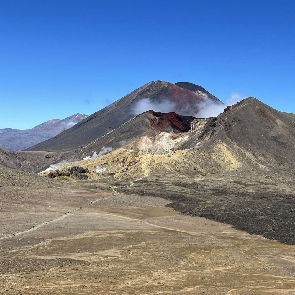 The Tongariro Crossing goes over this immense volcanic landscape that is different at every turn