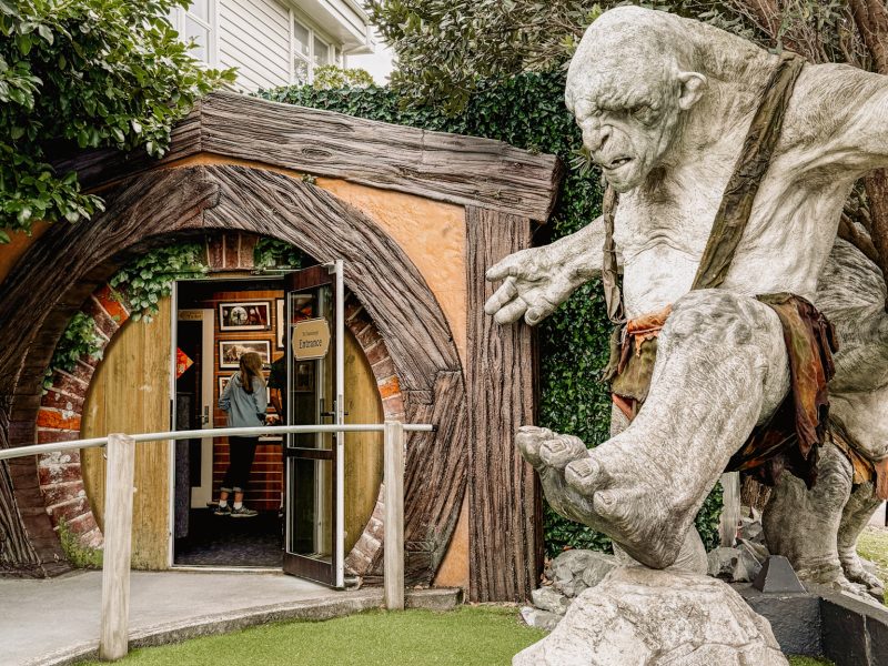 A troll standing at the entrance of a door at a building in Wellington