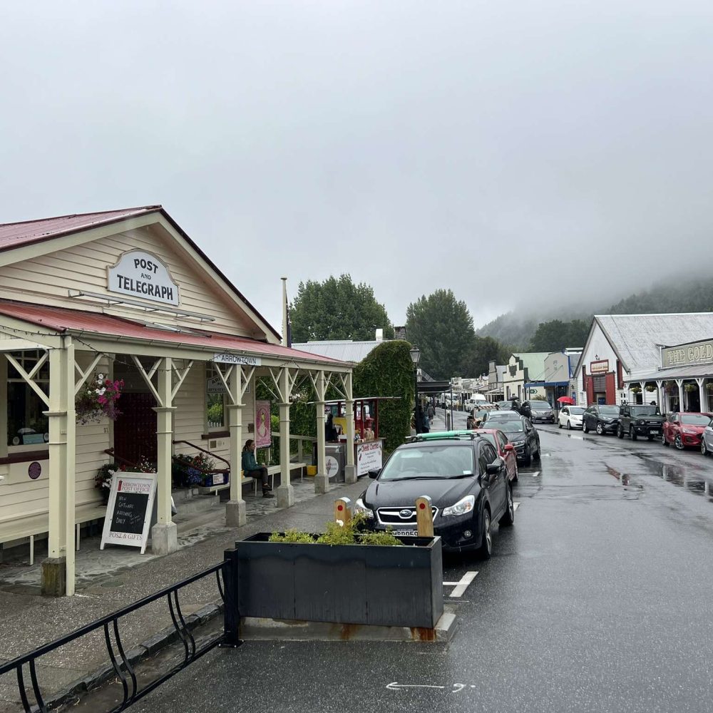 A rainy street down a historic town when visiting Queenstown