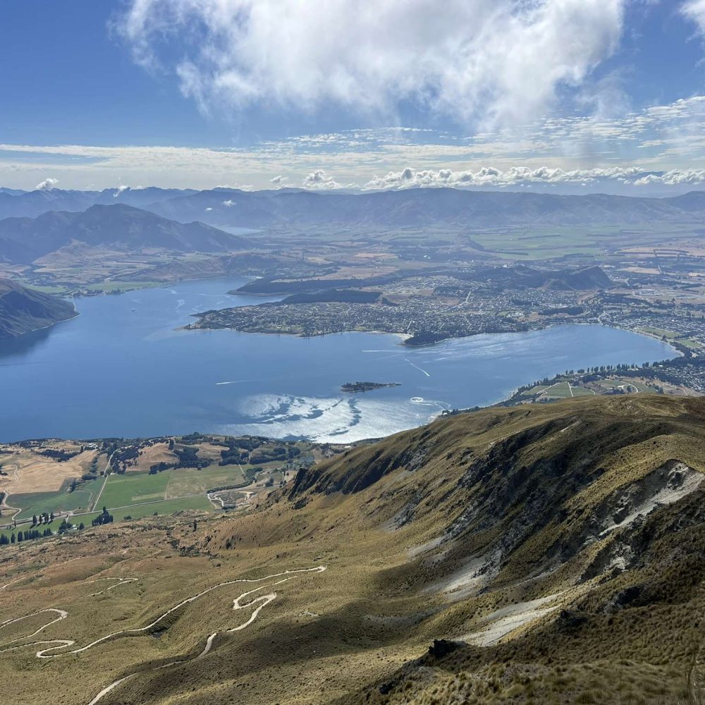 Overlooking a lake within mountains near the Southern Alps