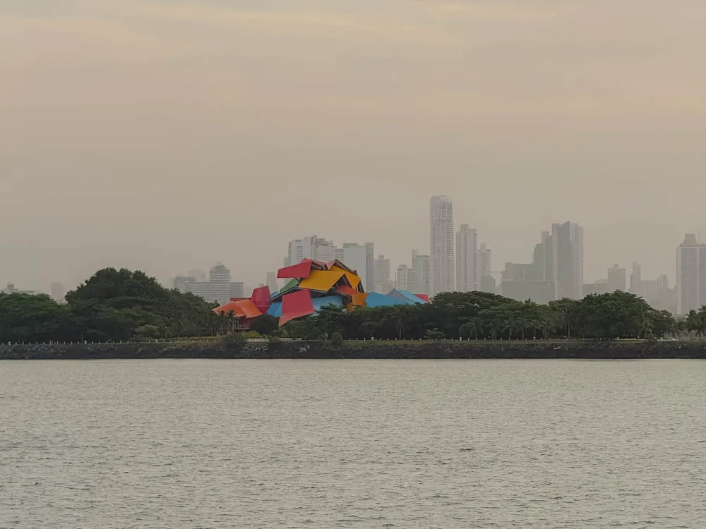 The brightly coloured Frank Gehry-designed Biomuseo building on the Amador Causeway with the Panama City skyline visible behind — things to do in Panama City