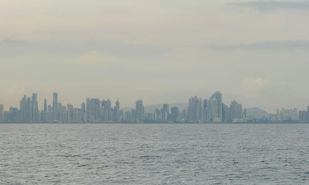 Panama City skyline stretching across the horizon as seen from the water on an overcast day — Panama City travel guide