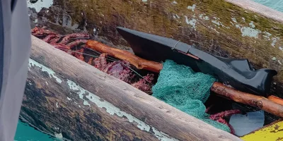 Traditional Guna wooden dugout canoe with fishing nets on the turquoise waters of San Blas - Guna Yala Panama