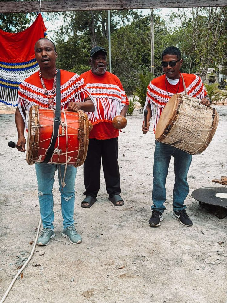 Suriname – Paramaribo-58 Three guys drumming as part of an Amerindian community as part of a Suriname itinerary