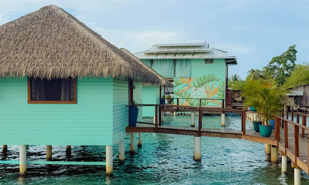 bocas-del-toro-sol-bungalows-overwater Turquoise over-water bungalows with thatched roofs at Sol Bungalows, Bocas del Toro