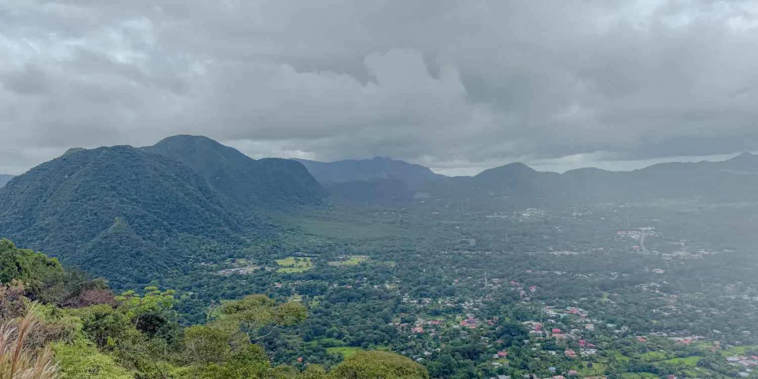 View from the volcanic rim looking down into the Valle de Anton crater floor with the town and farmland visible below -- Valle de Anton Panama